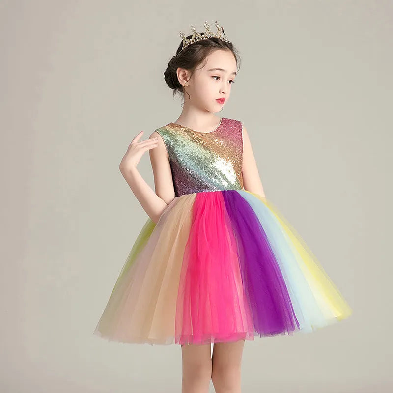 Girls cute rainbow skirt with lace and mesh layers, seven colours, 100% polyester outer, 80% cotton lining, available in sizes up to 160cm