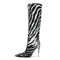 Women's leopard print pointed stiletto heel boots with side zipper on display