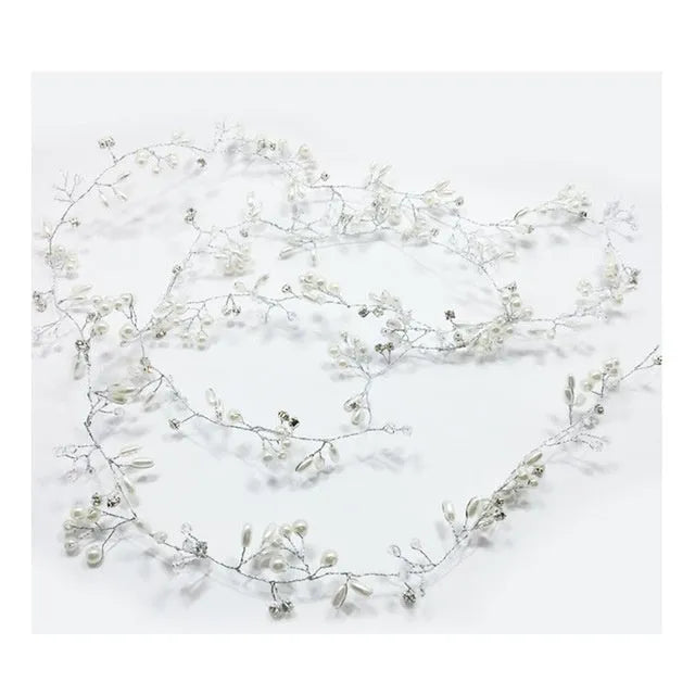 Bridal long hair band with crystals and pearls on a silver wire, shown coiled.