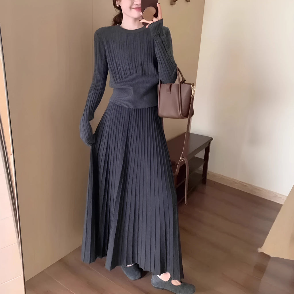 Dark grey knitted sweater and skirt set with a raised 3D pattern, shown as a complete artistic retro outfit.