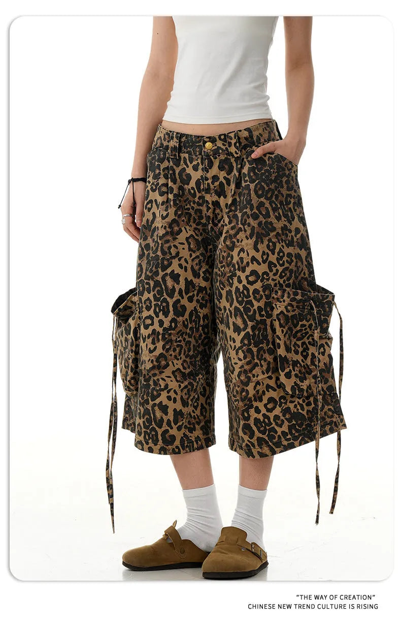 Women's high-waisted leopard print cropped trousers with a loose straight leg and button fly.