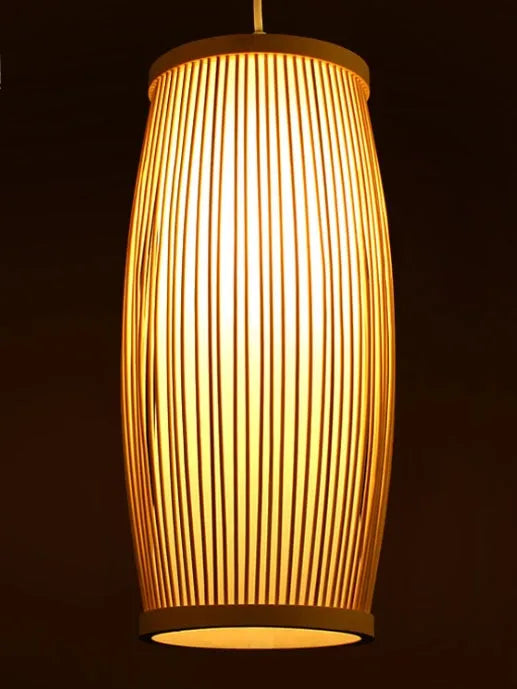 Small bamboo plaited wall light with natural finish, shown mounted on a wall.
