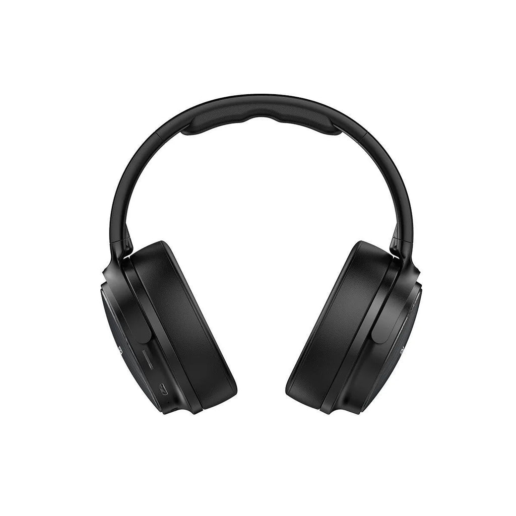 Awei black wireless Bluetooth over-ear headphones folded with audio cable and charging cable visible