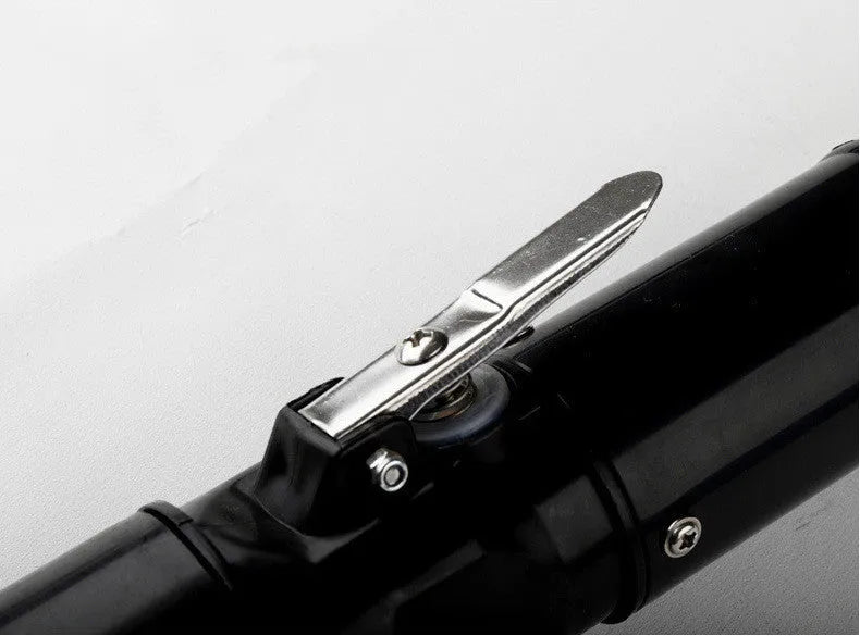 Black electric fish scale scraper with plastic shell and alloy parts, 7000 r/min descaling tool on a table