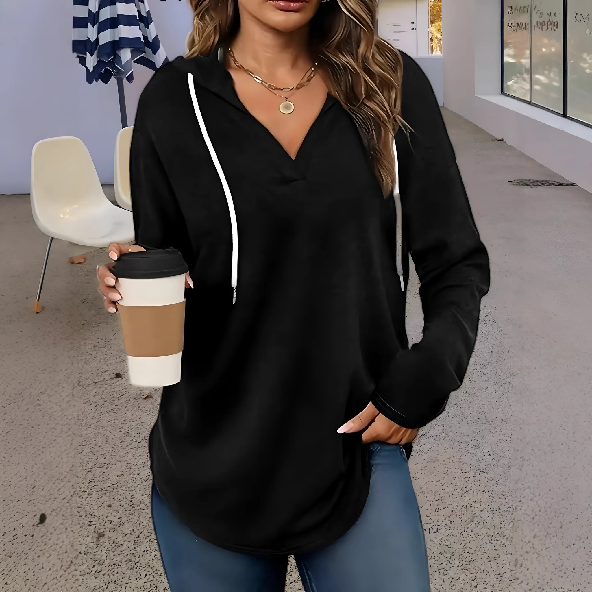 Women's red V-neck hooded sweatshirt with long sleeves and loose fit design