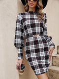 Black printed tight dress with lantern sleeves and leather stitching detail.