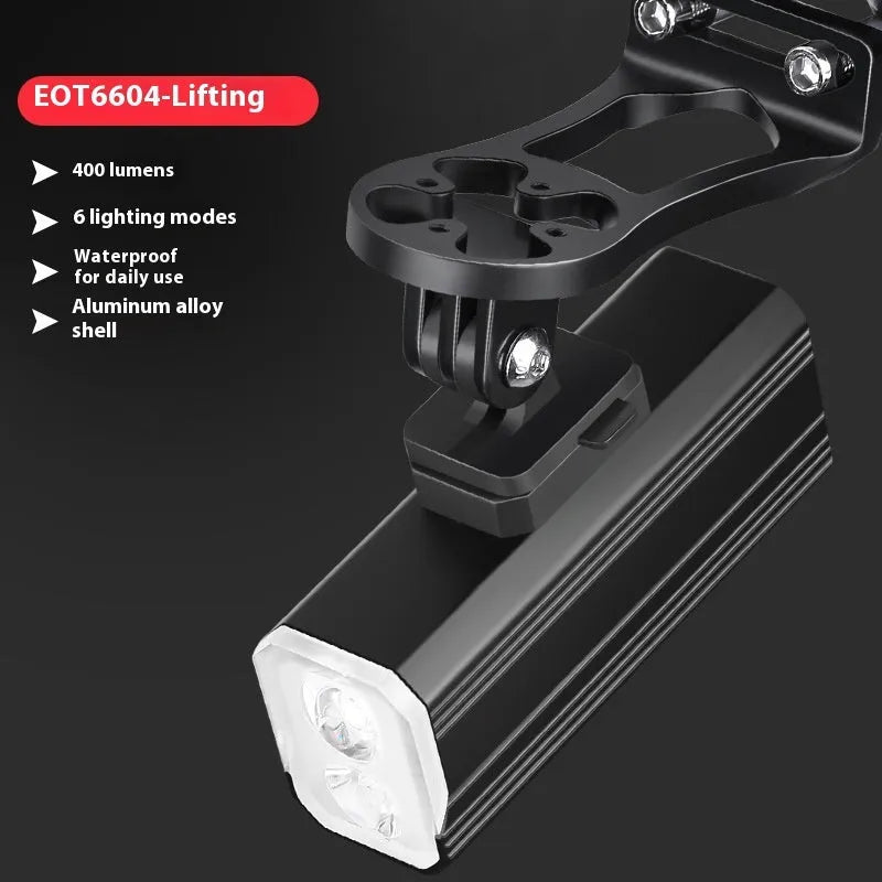 Aluminium alloy bicycle headlight with silicone mount on handlebars showing 400 lumen output