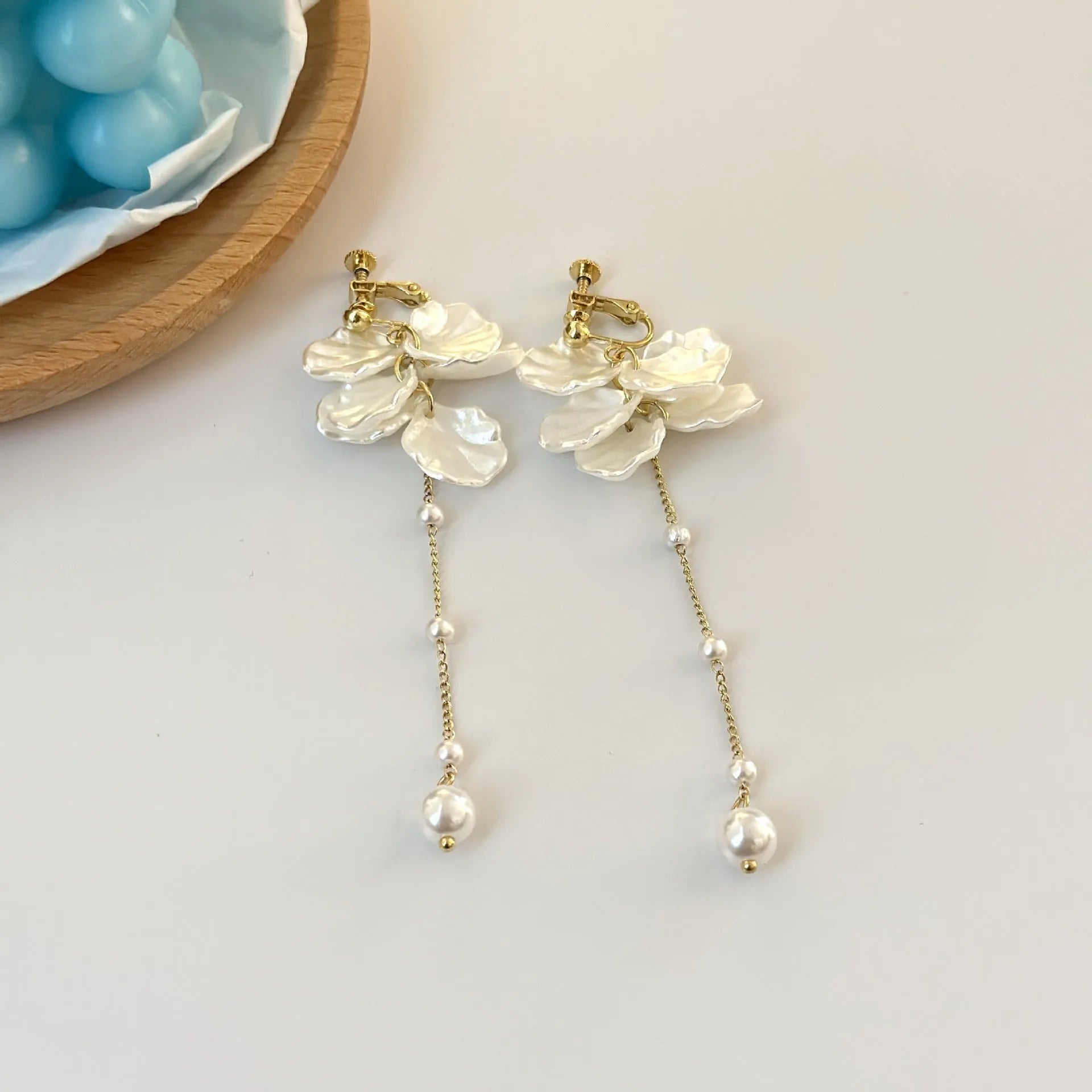 Long 8.8cm acrylic shell pearl tassel earrings for women with a choice of ear clip types.