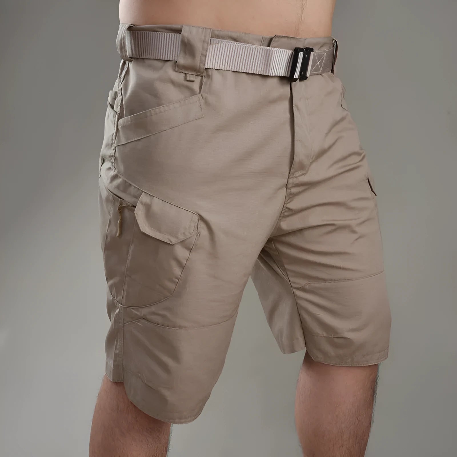 Men's khaki tactical shorts with button closure for hiking and outdoor work.
