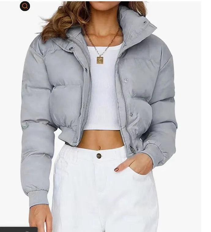 A woman's loose-fitting long sleeve polyester jacket in a casual style, shown in a blue colour variant.