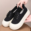 Women's camel suede platform loafers with round toe and front lace-up, showing flat 4cm heel.
