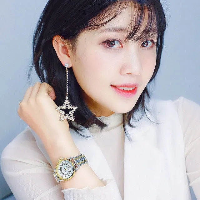 Women's quartz watch with 32mm round dial, alloy case, and mineral glass in a choice of gold or silver finishes