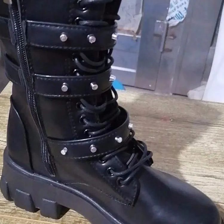 Black women's mid-calf boots with metal buckles and a side zip on a white background.