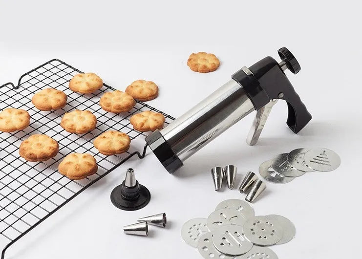 Stainless steel biscuit press with 13 moulds and 8 piping nozzles in a colour gift box
