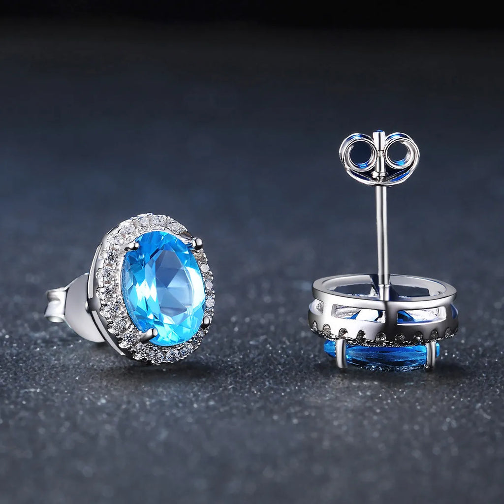 925 sterling silver geometric jewellery set with blue topaz gems including earrings, ring, necklace and pendant