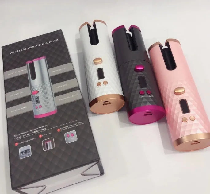 White portable automatic curling iron with USB cable and gold ceramic barrel on a pink background