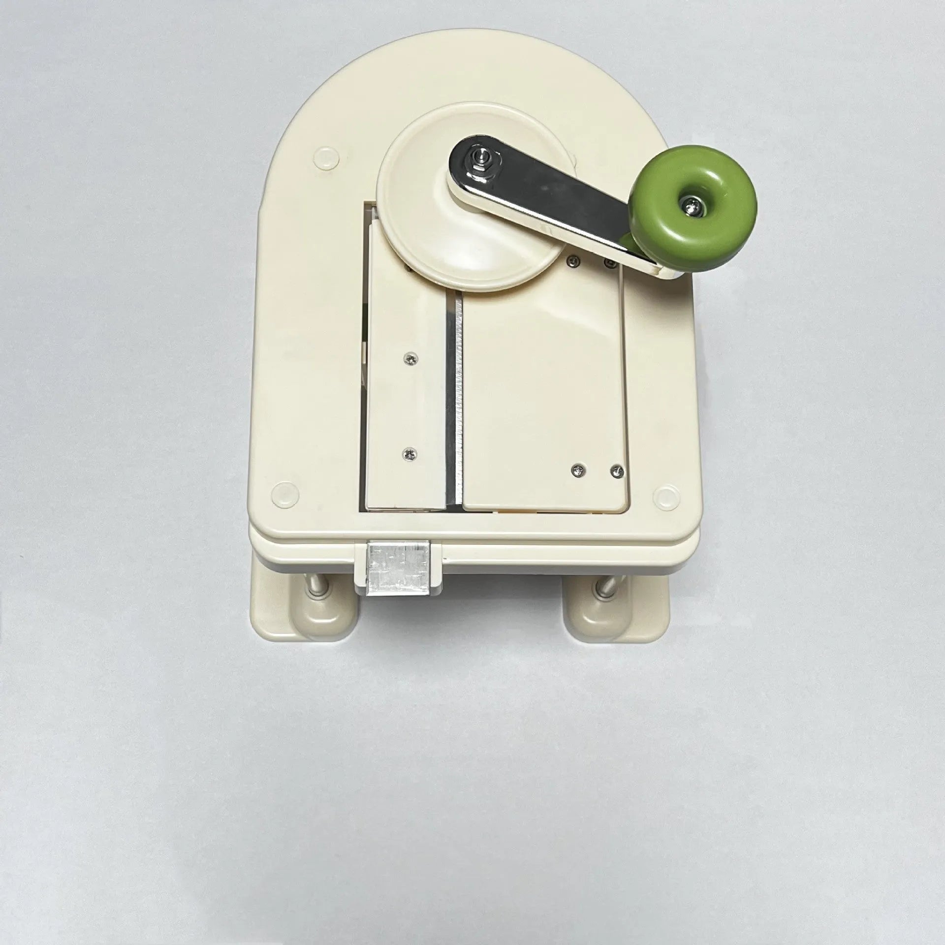 Beige stainless steel vegetable slicer chopper and grater for kitchen use
