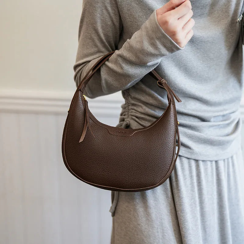 Women's one shoulder crossbody underarm handbag in PU, dumpling shape, 23cm wide, 120cm strap, black