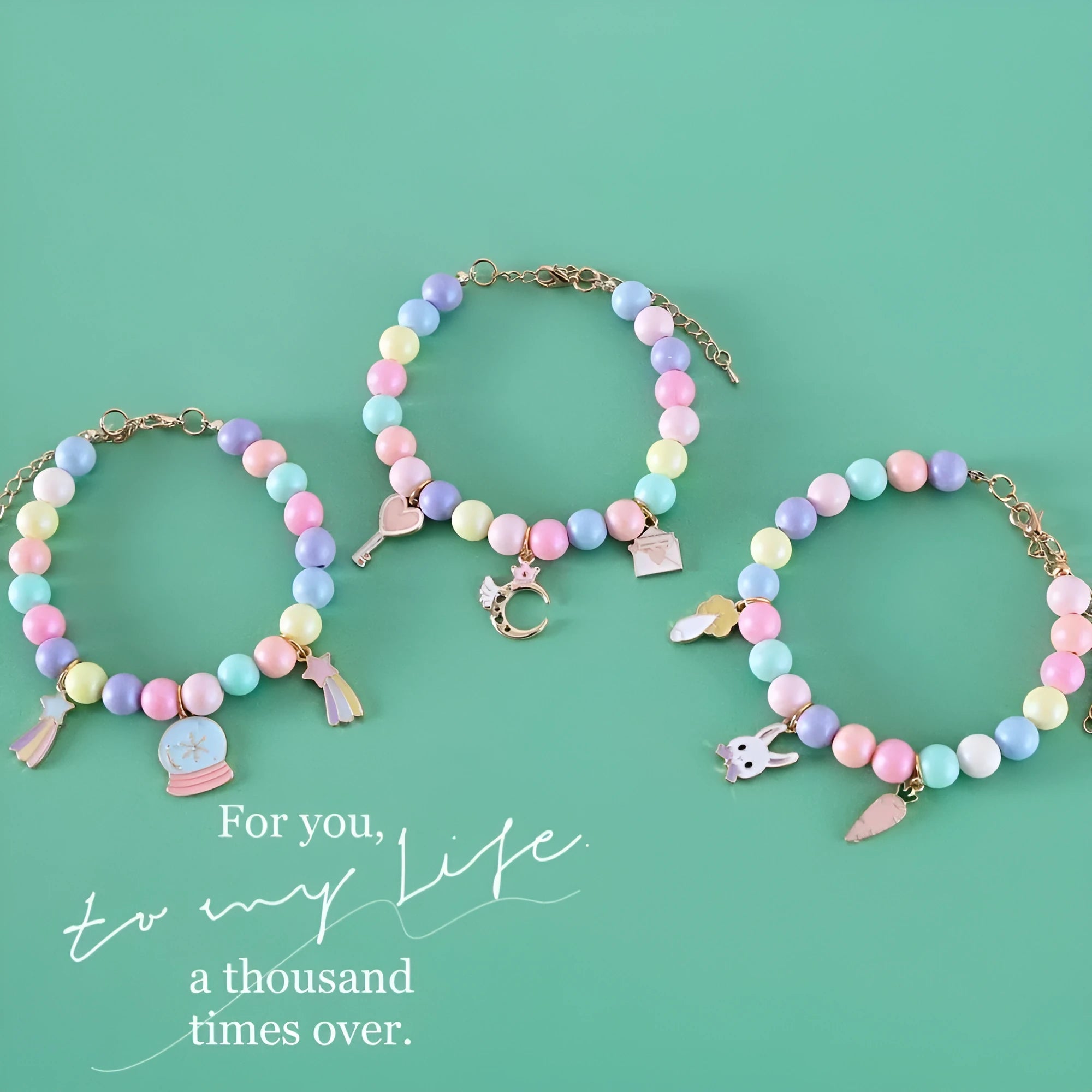 Colourful macaron charm pet collar and bracelet set for rabbits, cats, and dogs in three sizes.