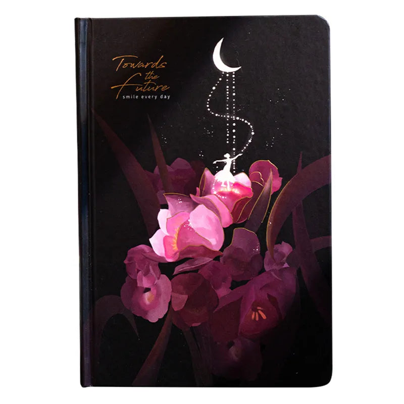 A5 hardback notebook with luminous cover open to show colour illustrated pages.
