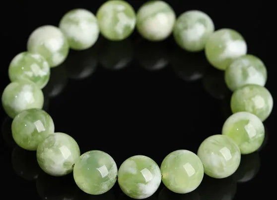 Green milk-in-water Xiuyan jade bracelet with geometric beads and polished finish