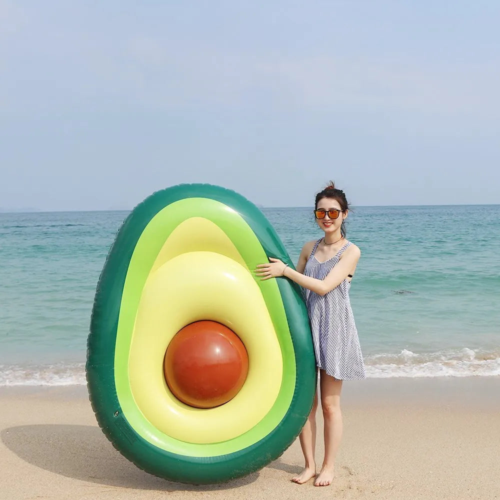 Giant green avocado-shaped inflatable pool float measuring 169cm by 130cm.