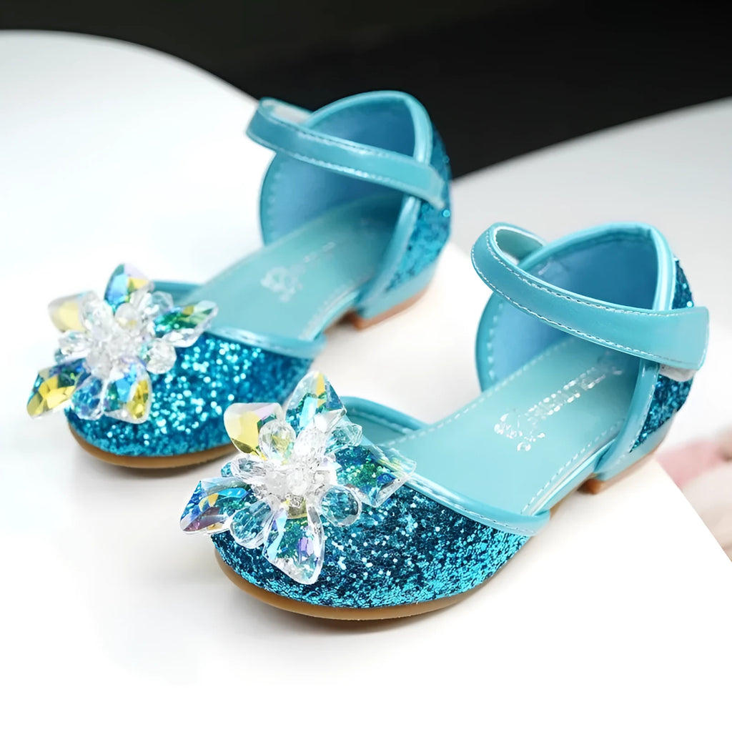 Girls crystal shoes with rhinestone decoration on shiny fabric upper, available in pink, blue, and silver