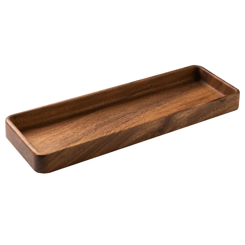 Walnut wooden fruit plate tray in rectangular size on a table surface.