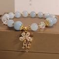 Normcore style unisex crystal lucky pearl bracelet aquamarine butterfly pink crystal butterfly on neutral background