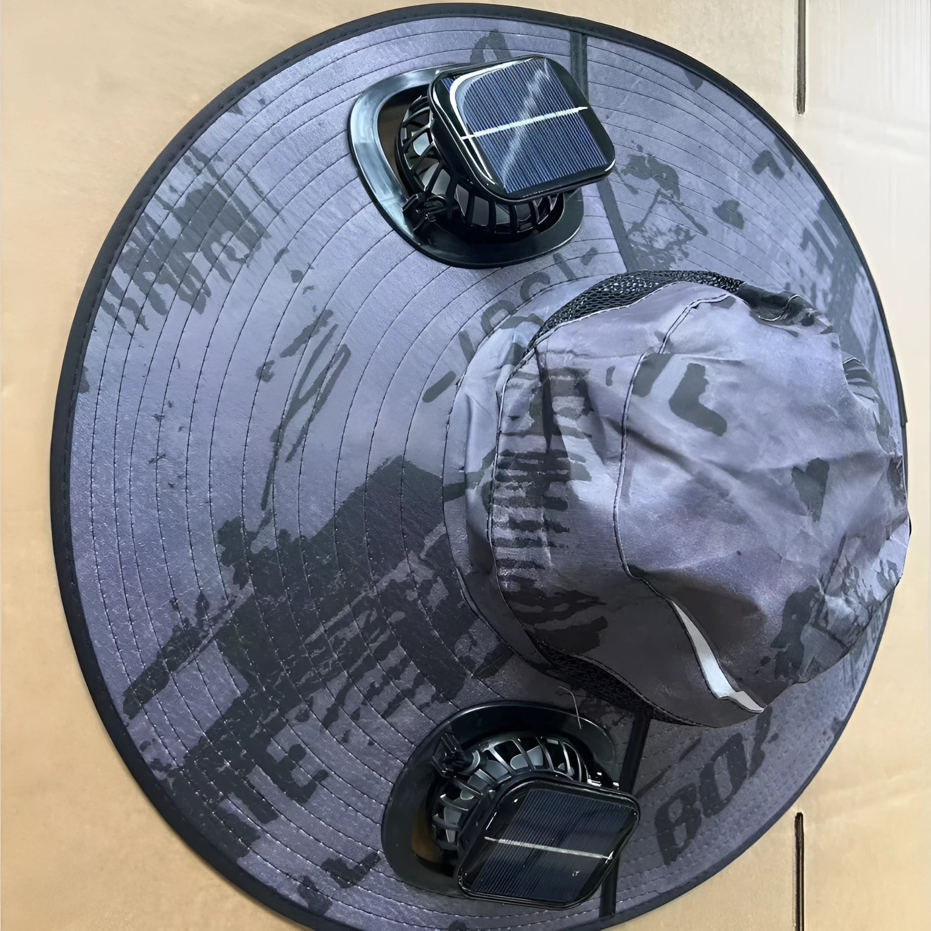 Men's grey solar fan cap with large shading eave and integrated cooling fan on brim.