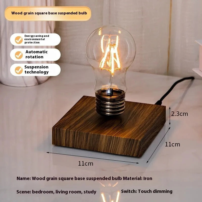 Iron art suspension bulb night lamp on a black wooden square base for desktop decoration.