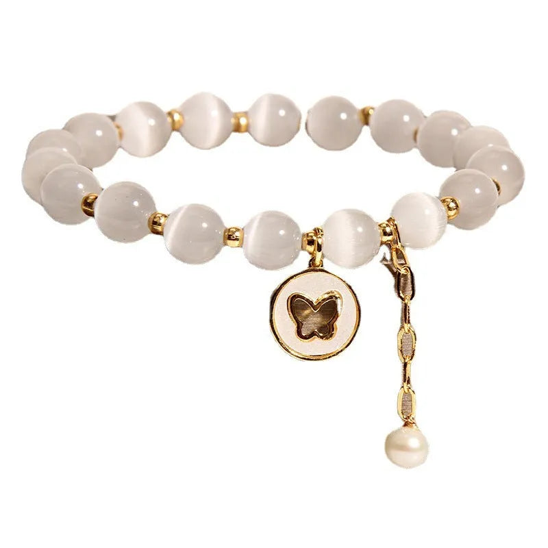 Handmade white cat's eye crystal bracelet with geometric Korean-style design.
