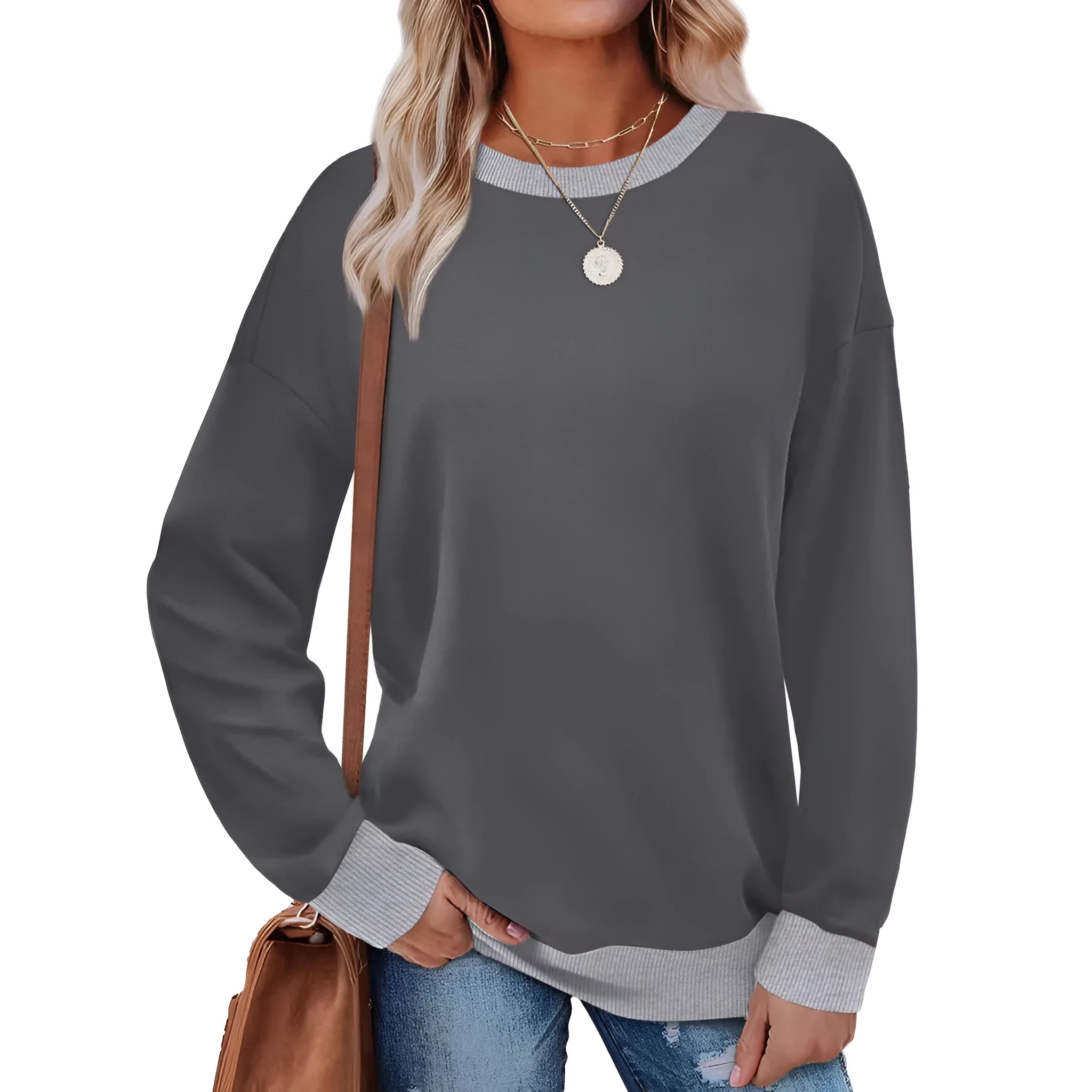 A woman wearing a loose-fitting striped long-sleeved top with a round neck in a grey colour.