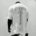 Man wearing a loose-fitting black pure cotton short sleeve top suitable for business casual wear.