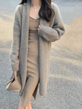 Women's loose fit knitted cardigan in khaki with V-neck and long sleeves.