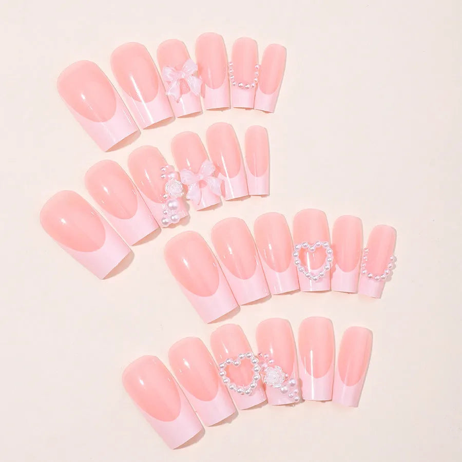 French Love Pearl fake nail stickers in colour XD93 with jelly glue and polish rub on a white background.