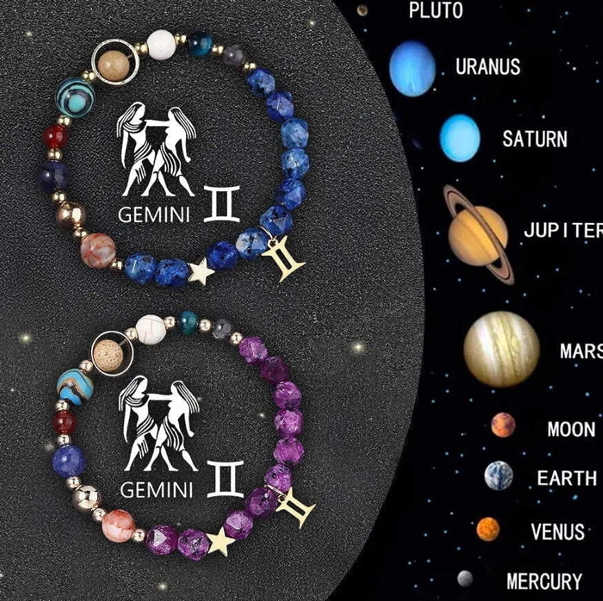 Two natural stone beaded bracelets with zodiac charms on a wrist.