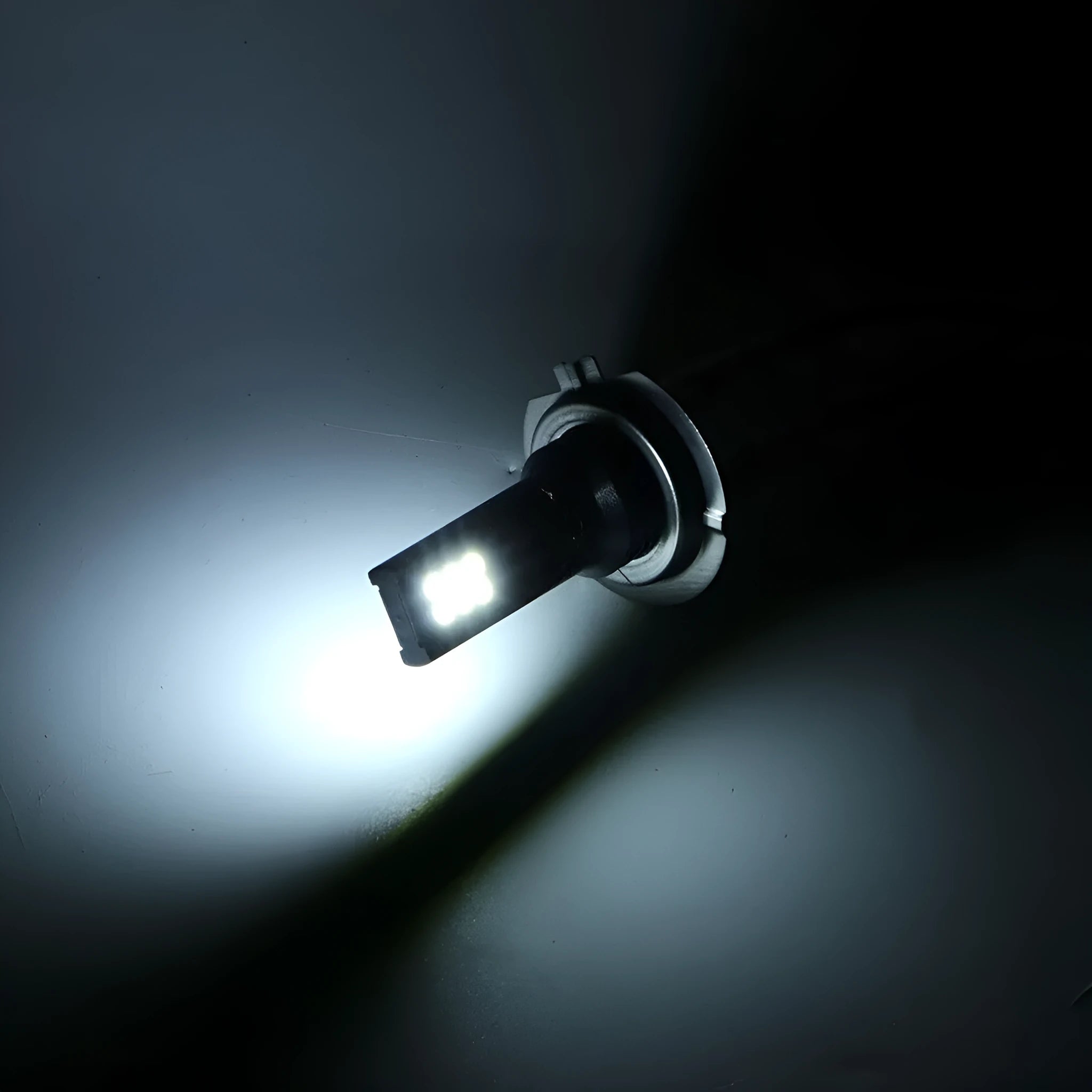 H7 110W LED fog light bulb with 12 SMD LEDs and aluminium body on white background.