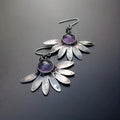 Purple Bohemian style earrings with floral and animal zodiac design in alloy and resin.