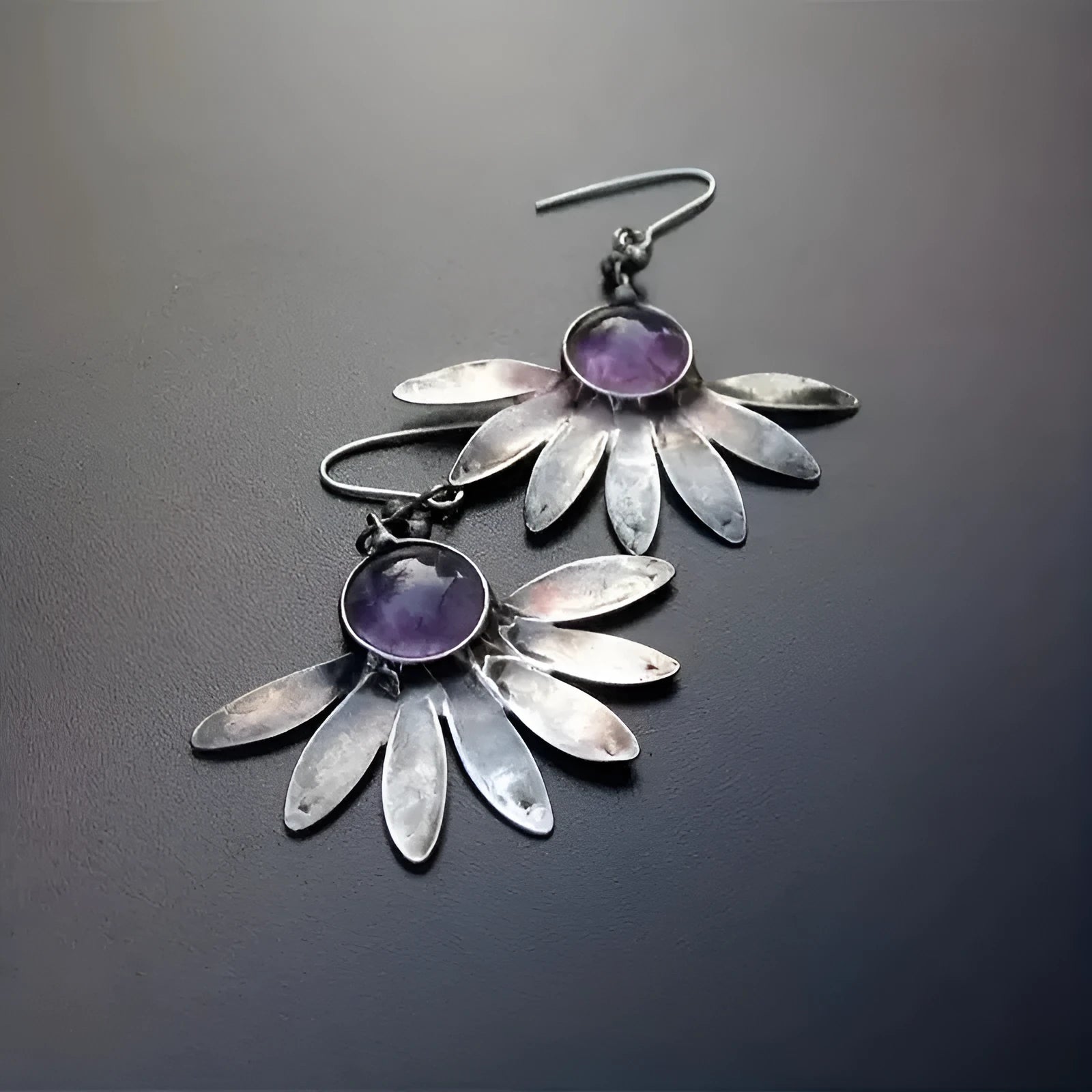 Purple Bohemian style earrings with floral and animal zodiac design in alloy and resin.