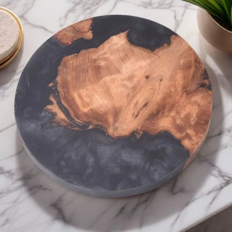 A solid colour resin coaster on a wooden table, showing its 1cm thickness and irregular Nordic shape.