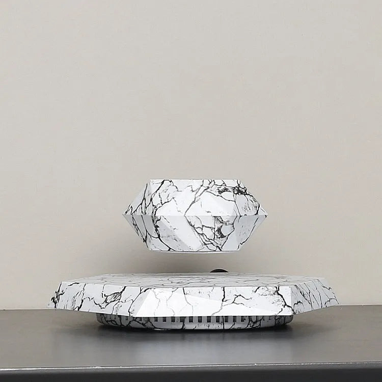 Marbling colour magnetic levitating plant pot floating with bonsai in modern home setting