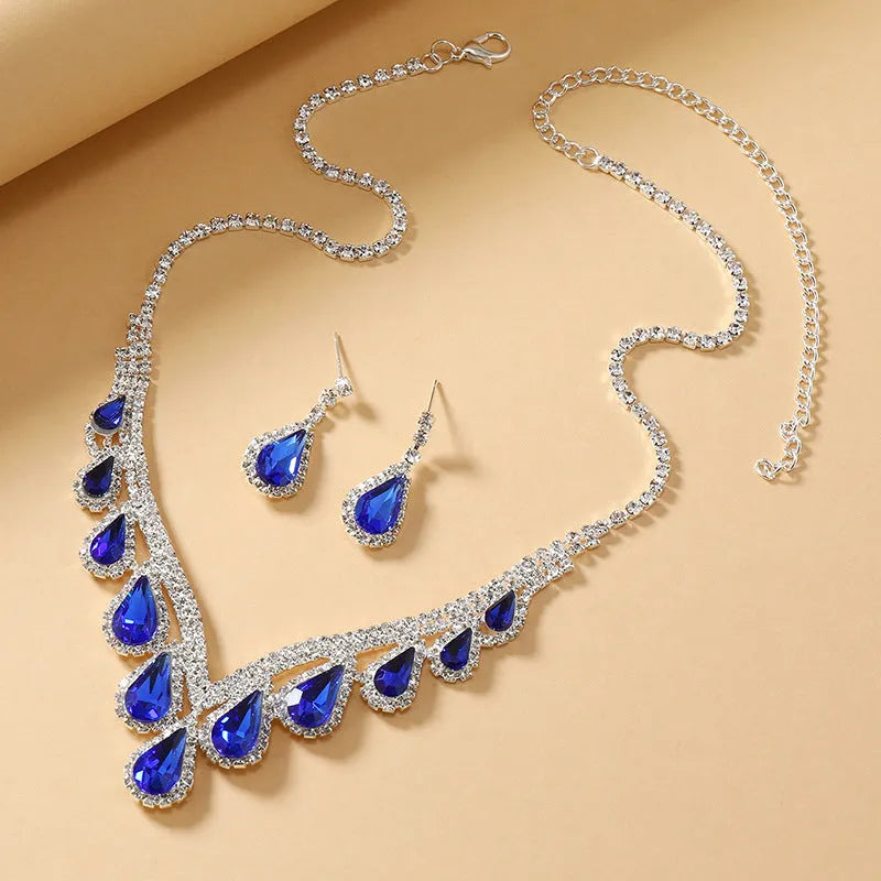 Sapphire blue alloy clavicle chain necklace and earrings set in Royal Blue White K finish on display