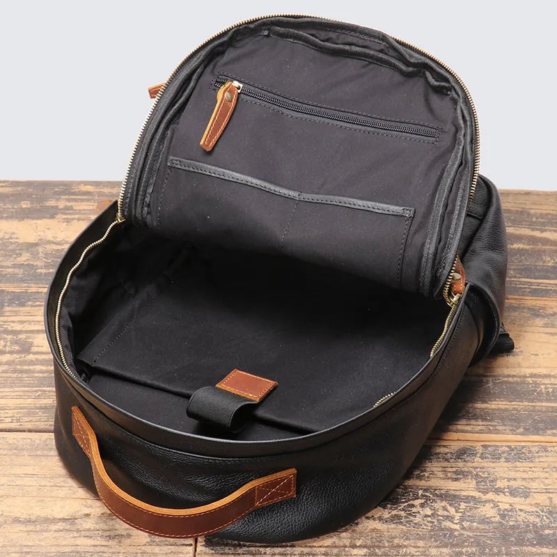 Genuine leather top grain cowhide expandable travel backpack in black with curved shoulder strap