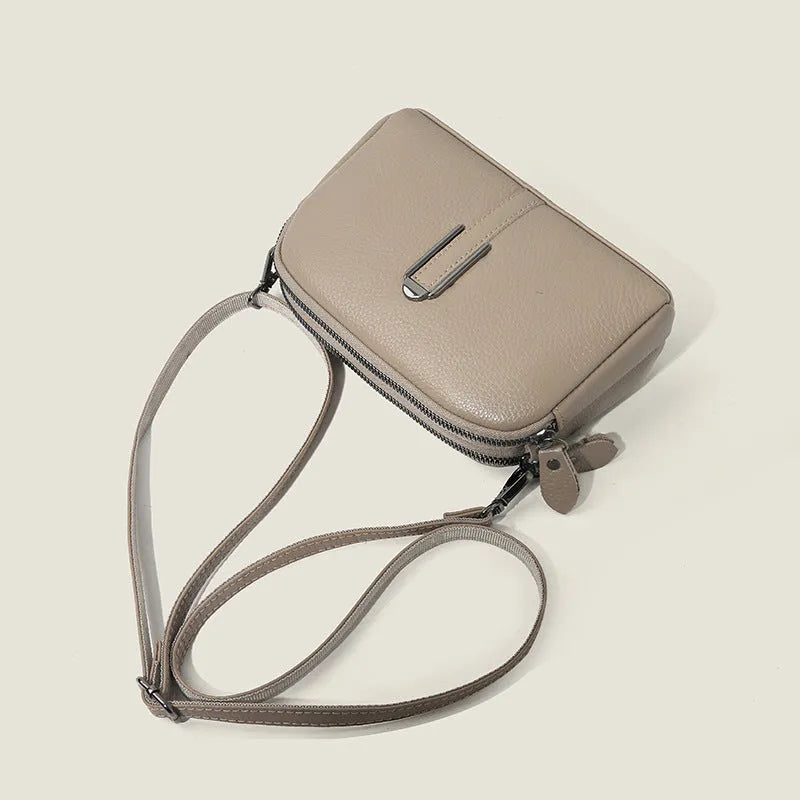 Minimalist top-grain leather crossbody bag in khaki with splicing detail and inner pockets