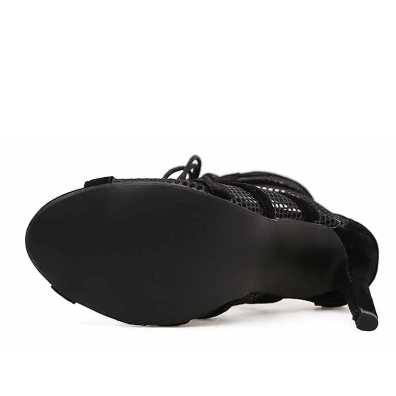 Black suede women's lace-up high heel shoes with a pointed toe and stiletto heel.