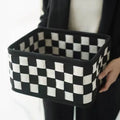 Checkerboard patterned grey felt folding storage basket with dimensions 37cm by 29cm.