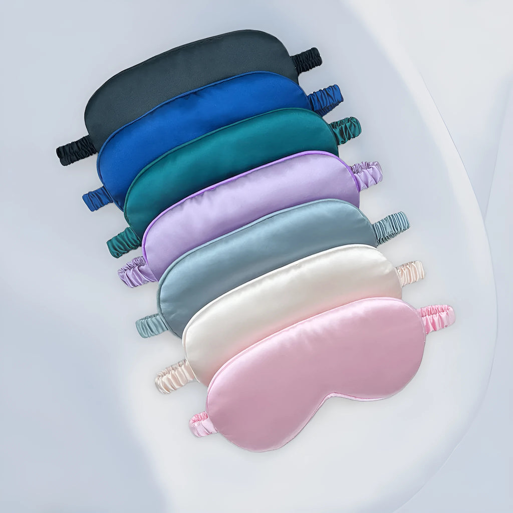 Rayon satin sleep mask in various colours showing double-sided silk-like fabric and elastic strap.