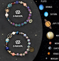 Close-up of an adjustable natural stone beaded bracelet with a metal hook clasp and extension chain on a wrist.
