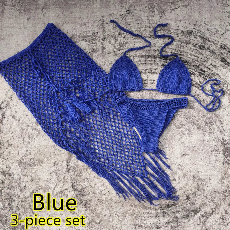 Women's white handmade crochet bikini swimsuit set with a separate matching skirt.
